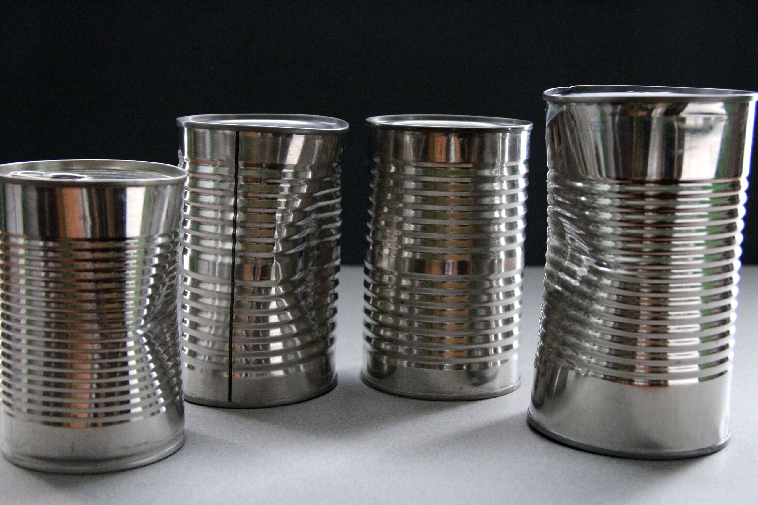 four-unlabeled-metal-cans-containing-unknown-foods