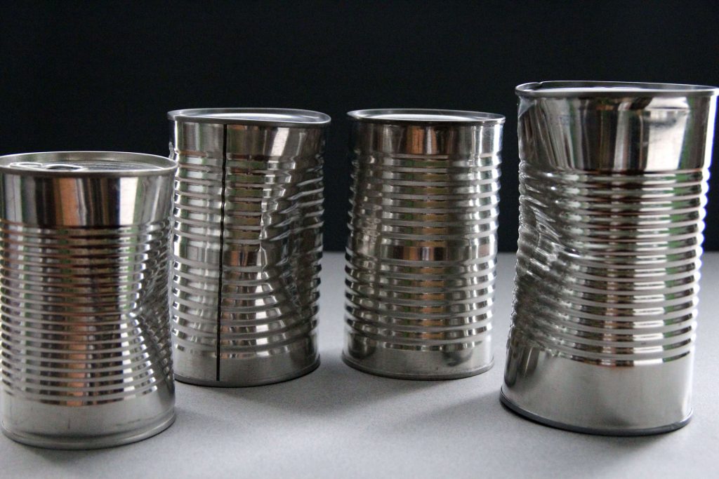 four-unlabeled-metal-cans-containing-unknown-foods